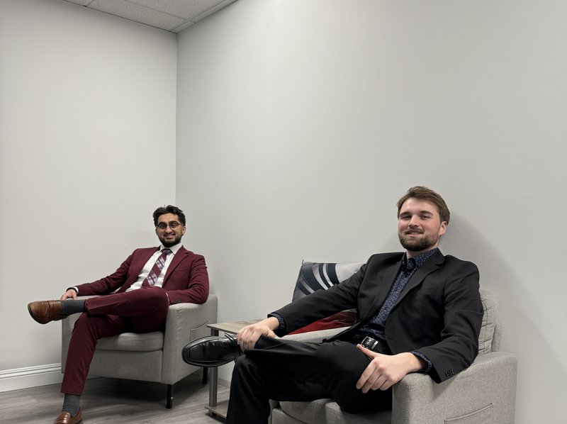 Two Forge Marketing team members relaxing in the office between client visits